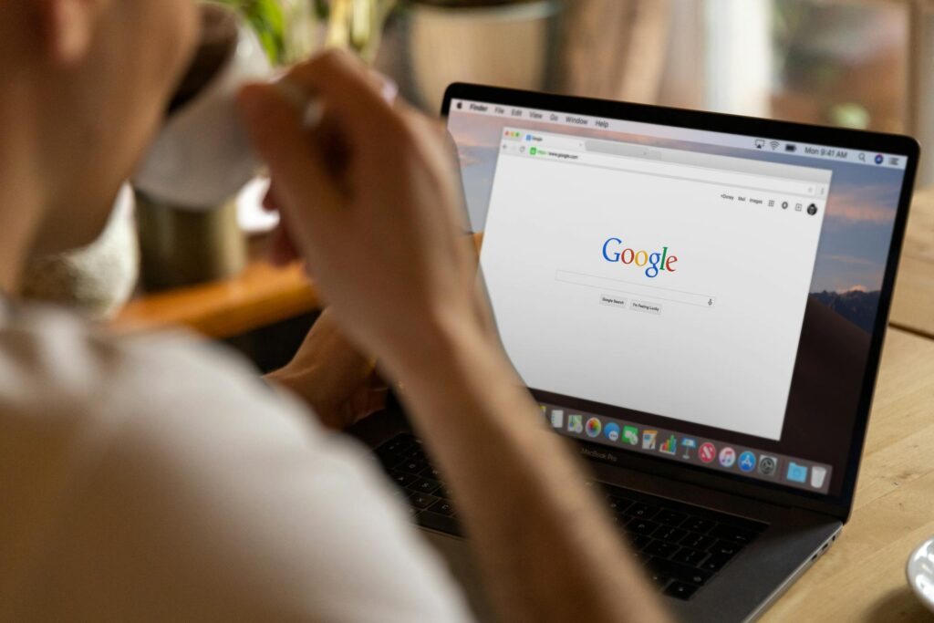 A person sitting in front of a laptop