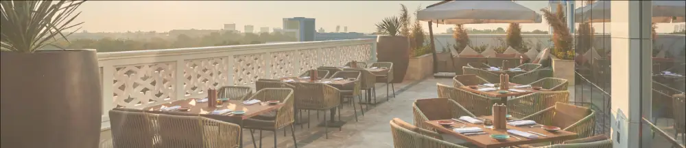 a restaurant with a view of the city