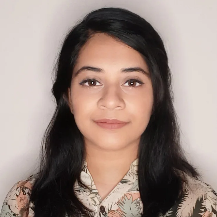 a woman with long black hair wearing a shirt